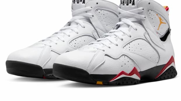 View of white and navy Air Jordan shoes.